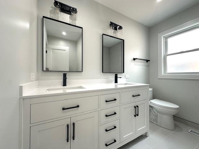 7646 W Myrtle Ave, Chicago, IL 60631 - bathroom with double vanity and toilet
