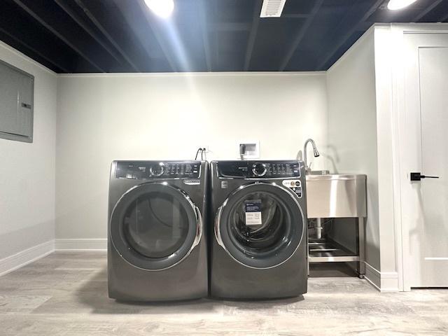 7646 W Myrtle Ave, Chicago, IL 60631 - laundry area with wood finished floors, separate washer and dryer, and electric panel