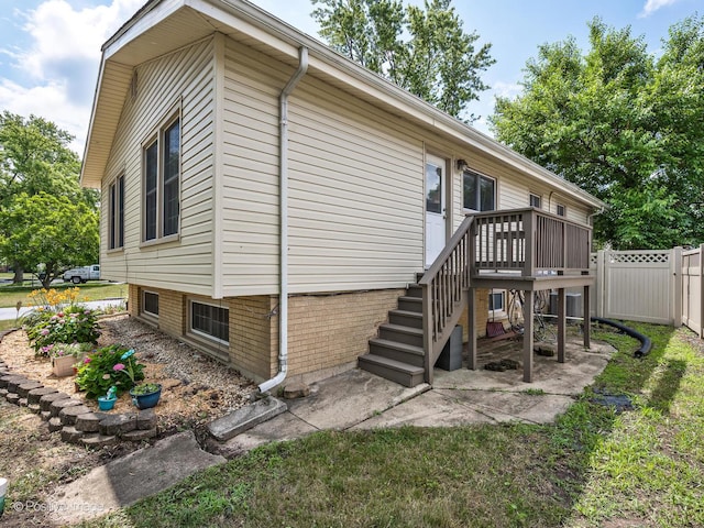 18902 Jonathan Ln, Homewood, IL 60430 - view of property exterior featuring a deck and stairs