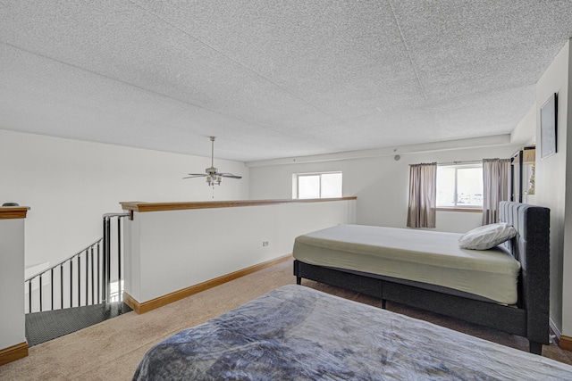7050 183rd St Unit 409, Tinley Park, IL 60477 - carpeted bedroom with multiple windows and a textured ceiling