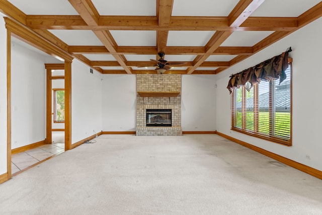 552 Waters Edge Dr, South Elgin, IL 60177 - unfurnished living room with light colored carpet, a ceiling fan, a fireplace, coffered ceiling, and beam ceiling