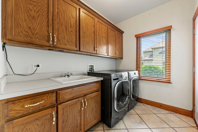 552 Waters Edge Dr, South Elgin, IL 60177 - laundry room with cabinet space, separate washer and dryer, and light tile patterned floors