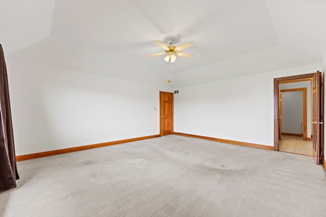 552 Waters Edge Dr, South Elgin, IL 60177 - spare room featuring light carpet, a ceiling fan, and a raised ceiling