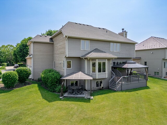 552 Waters Edge Dr, South Elgin, IL 60177 - back of property featuring a gazebo, a yard, a chimney, and a patio area
