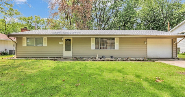 2407 W William St, Champaign, IL 61821 - ranch-style house featuring an attached garage, driveway, a front lawn, and a chimney
