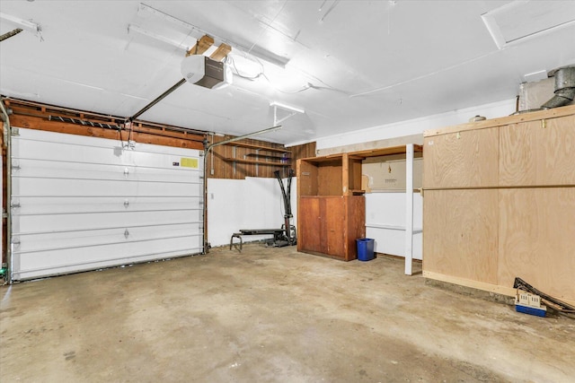 2407 W William St, Champaign, IL 61821 - garage featuring a garage door opener