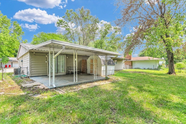 2407 W William St, Champaign, IL 61821 - back of property featuring a storage shed and a patio