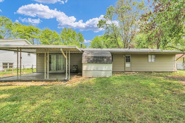 2407 W William St, Champaign, IL 61821 - back of property with a carport, a patio area, and roof with shingles