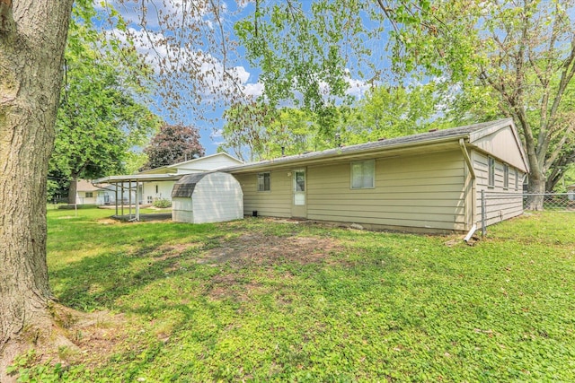 2407 W William St, Champaign, IL 61821 - back of house with a storage shed