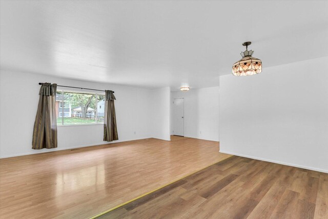 2407 W William St, Champaign, IL 61821 - unfurnished room featuring wood finished floors