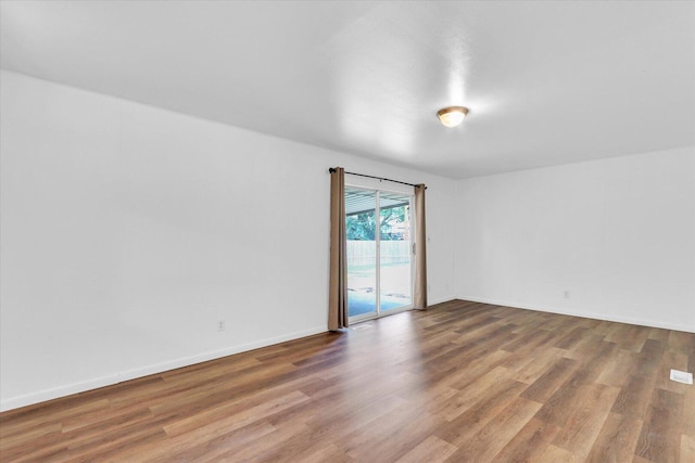 2407 W William St, Champaign, IL 61821 - spare room with wood finished floors