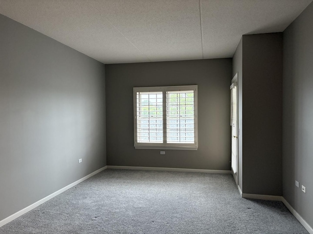 200 N Addison Ave Unit 505, Elmhurst, IL 60126 - carpeted empty room featuring a textured ceiling and baseboards