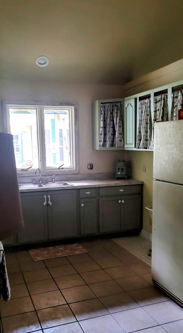 2S720 Nelson Lake Rd, Batavia, IL 60510 - kitchen with freestanding refrigerator, healthy amount of natural light, light tile patterned floors, and light countertops