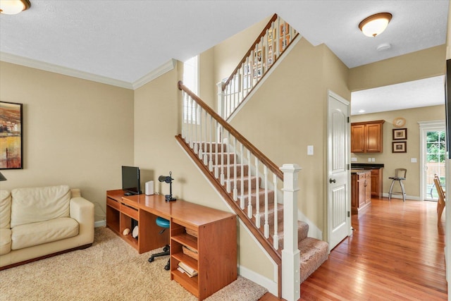 407 Banbury Ln, Savoy, IL 61874 - office area featuring light wood-style flooring and crown molding