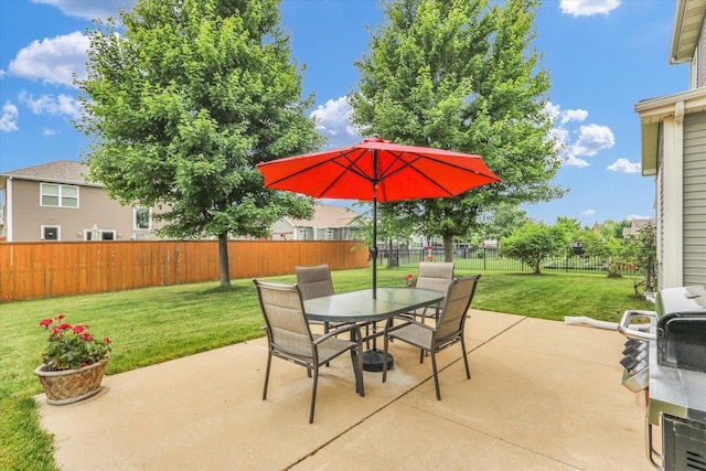 407 Banbury Ln, Savoy, IL 61874 - fenced backyard with outdoor dining space, a patio, and area for grilling