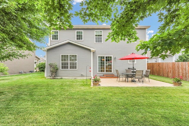 407 Banbury Ln, Savoy, IL 61874 - back of property with a patio area