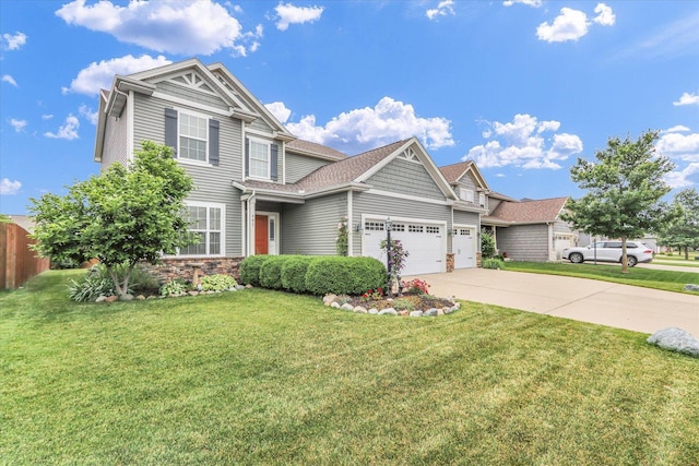 407 Banbury Ln, Savoy, IL 61874 - view of front of house with a garage, concrete driveway, and stone siding