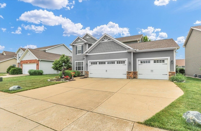 407 Banbury Ln, Savoy, IL 61874 - craftsman house with a front yard and stone siding
