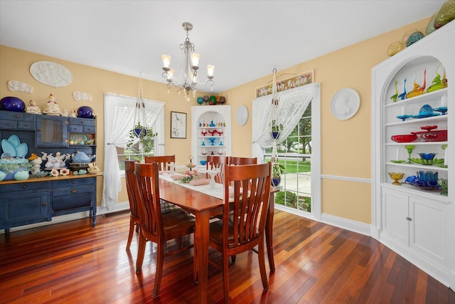 233 S Elmwood Dr, Aurora, IL 60506 - dining room featuring a chandelier, plenty of natural light, hardwood / wood-style flooring, and baseboards