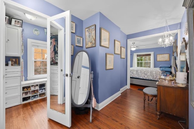 233 S Elmwood Dr, Aurora, IL 60506 - bedroom featuring wood finished floors, baseboards, and a chandelier