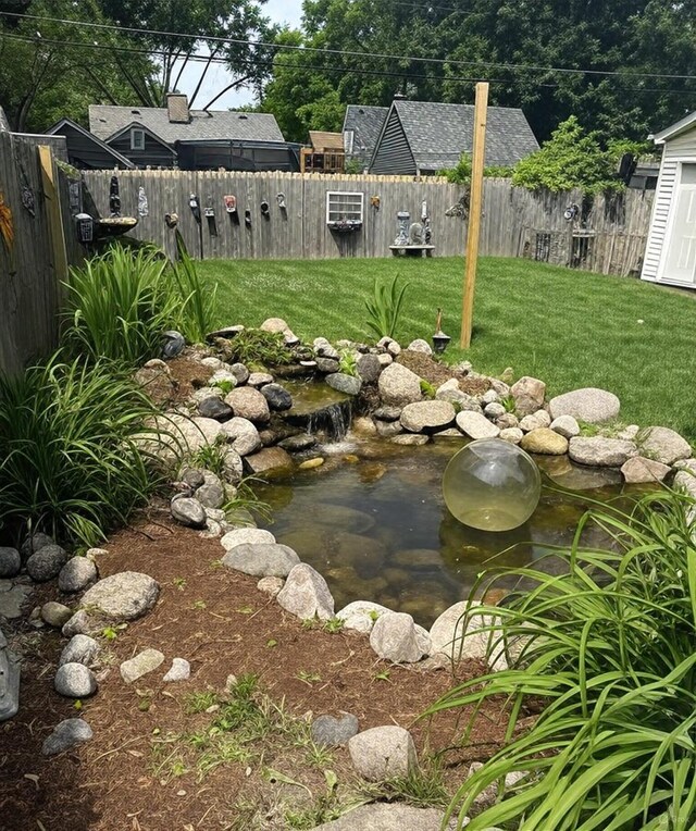 233 S Elmwood Dr, Aurora, IL 60506 - view of yard featuring a garden pond