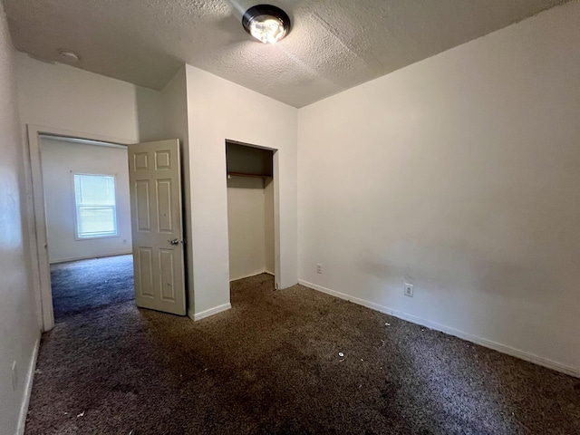 1205 W Beech St, Urbana, IL 61801 - unfurnished bedroom with carpet flooring and a textured ceiling