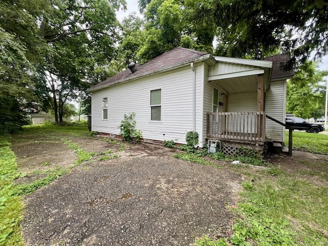 1205 W Beech St, Urbana, IL 61801 - view of home's exterior with a porch and roof with shingles