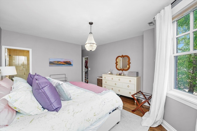 2500 N Seminary Ave Unit 4W, Chicago, IL 60614 - bedroom with wood finished floors and a chandelier