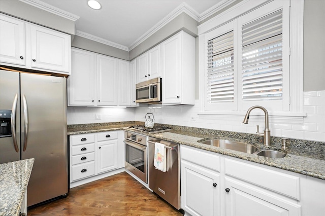 2500 N Seminary Ave Unit 4W, Chicago, IL 60614 - kitchen featuring stainless steel appliances, backsplash, white cabinetry, crown molding, and recessed lighting