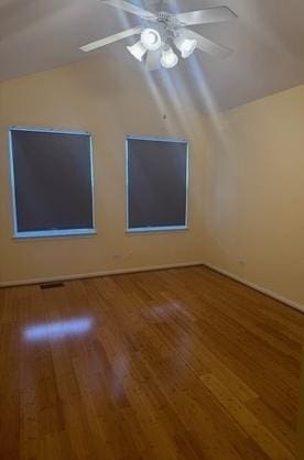 5387 Elizabeth Pl Unit 1302, Rolling Meadows, IL 60008 - empty room with vaulted ceiling, wood finished floors, and a ceiling fan