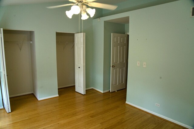 5387 Elizabeth Pl Unit 1302, Rolling Meadows, IL 60008 - unfurnished bedroom featuring multiple closets, light wood-style floors, and a ceiling fan