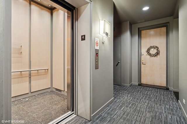 1035 W Huron St Unit 402, Chicago, IL 60642 - hall with elevator, dark carpet, and recessed lighting