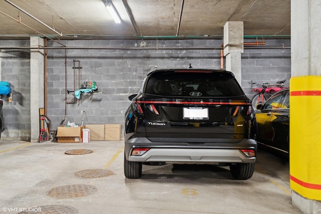 1035 W Huron St Unit 402, Chicago, IL 60642 - parking deck featuring concrete block wall