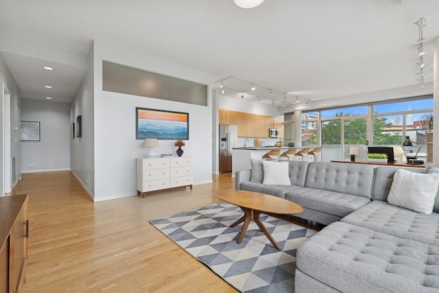 1035 W Huron St Unit 402, Chicago, IL 60642 - living area featuring track lighting, light wood-style floors, and recessed lighting