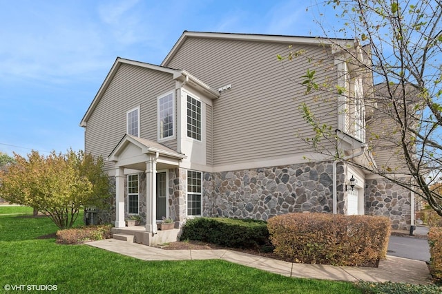 15130 Laurel Ln, Lockport, IL 60441 - view of property exterior with stone siding and a lawn