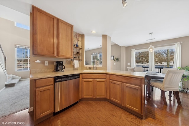 15130 Laurel Ln, Lockport, IL 60441 - kitchen featuring dishwasher, light countertops, a peninsula, light wood-type flooring, and pendant lighting