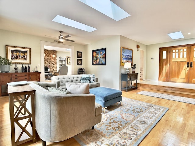 249 Jervey Ln, Bartlett, IL 60103 - living room featuring a skylight, light wood finished floors, and a ceiling fan