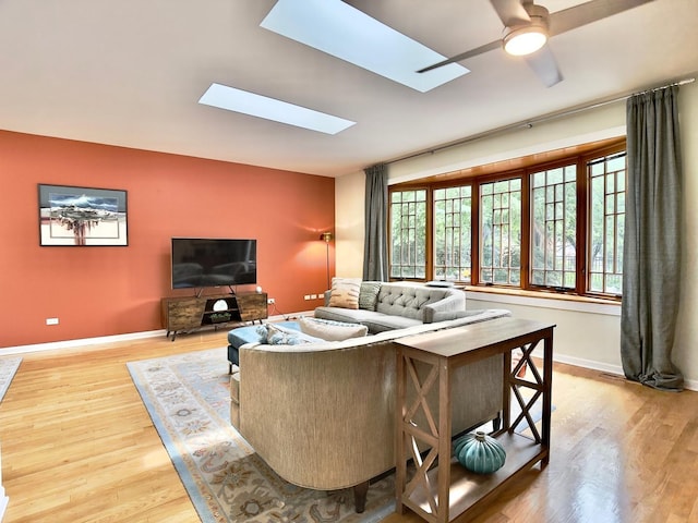 249 Jervey Ln, Bartlett, IL 60103 - living room with wood finished floors, ceiling fan, and a skylight