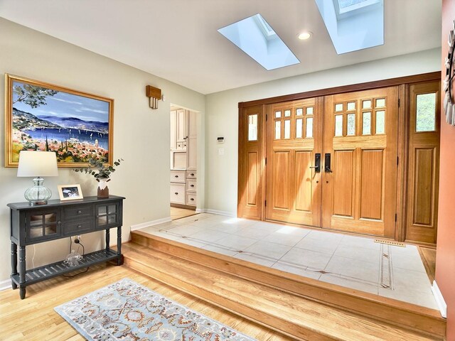 249 Jervey Ln, Bartlett, IL 60103 - entrance foyer with a skylight, light wood finished floors, and recessed lighting