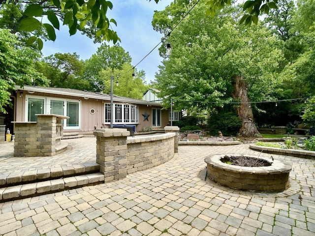 249 Jervey Ln, Bartlett, IL 60103 - view of patio featuring an outdoor fire pit