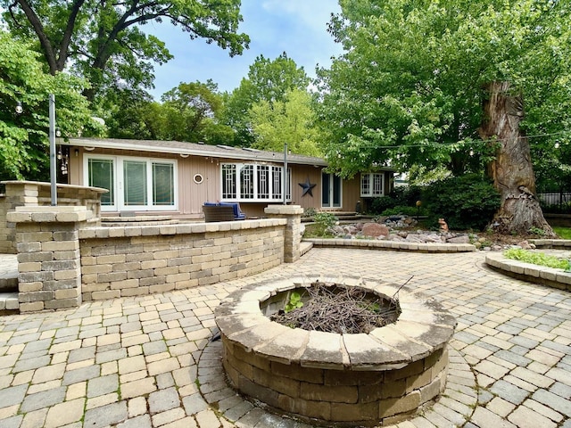 249 Jervey Ln, Bartlett, IL 60103 - view of patio featuring a fire pit