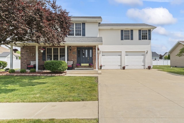 925 Magnolia Dr, Bourbonnais, IL 60914 - view of front facade featuring concrete driveway, a garage, and brick siding