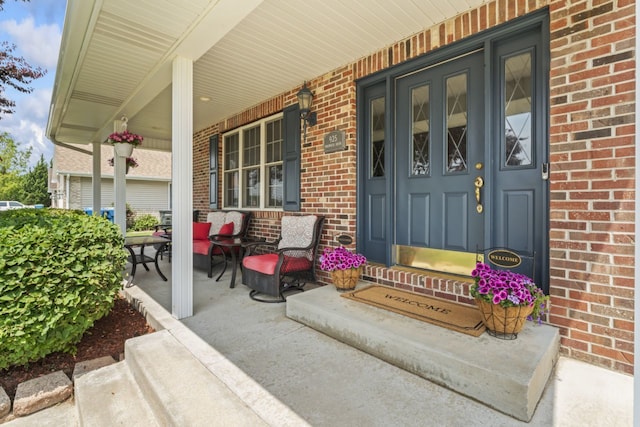 925 Magnolia Dr, Bourbonnais, IL 60914 - entrance to property featuring a porch and brick siding
