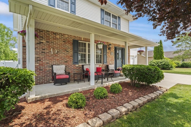 925 Magnolia Dr, Bourbonnais, IL 60914 - view of exterior entry with a porch and brick siding