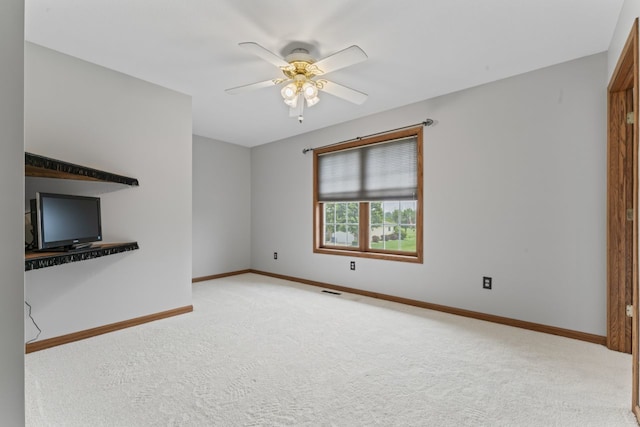 925 Magnolia Dr, Bourbonnais, IL 60914 - unfurnished living room featuring carpet and a ceiling fan