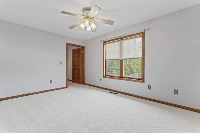 925 Magnolia Dr, Bourbonnais, IL 60914 - empty room with light colored carpet and ceiling fan