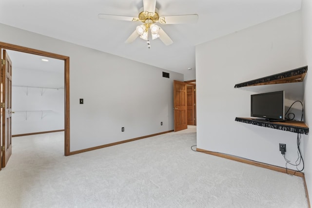 925 Magnolia Dr, Bourbonnais, IL 60914 - unfurnished living room with carpet floors and a ceiling fan