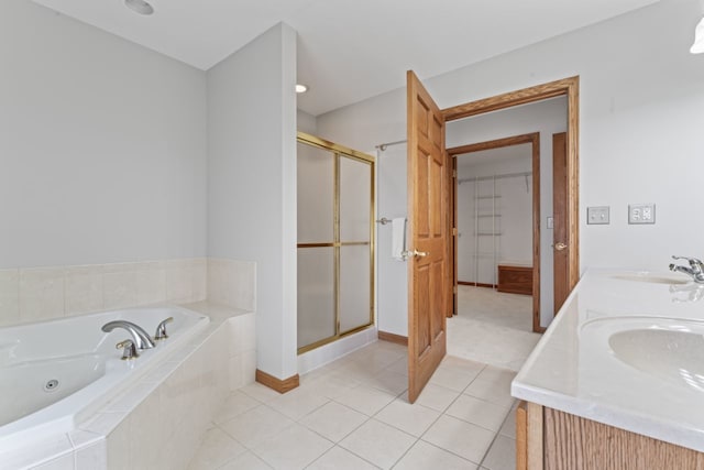 925 Magnolia Dr, Bourbonnais, IL 60914 - bathroom featuring a tub with jets, a shower stall, tile patterned floors, and double vanity