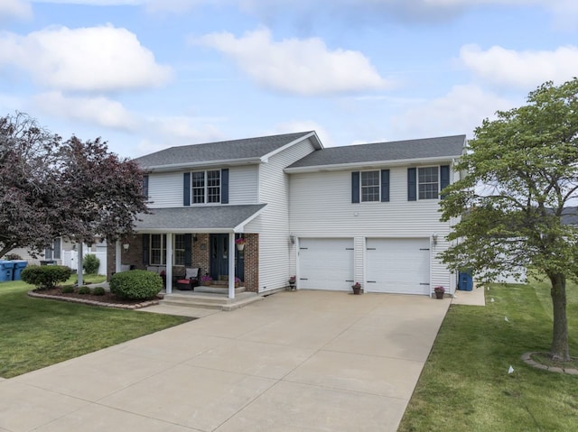 925 Magnolia Dr, Bourbonnais, IL 60914 - traditional-style home featuring driveway, covered porch, a garage, and a front lawn