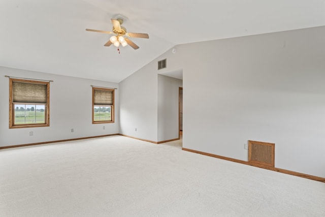 925 Magnolia Dr, Bourbonnais, IL 60914 - unfurnished room featuring light colored carpet, a ceiling fan, and vaulted ceiling